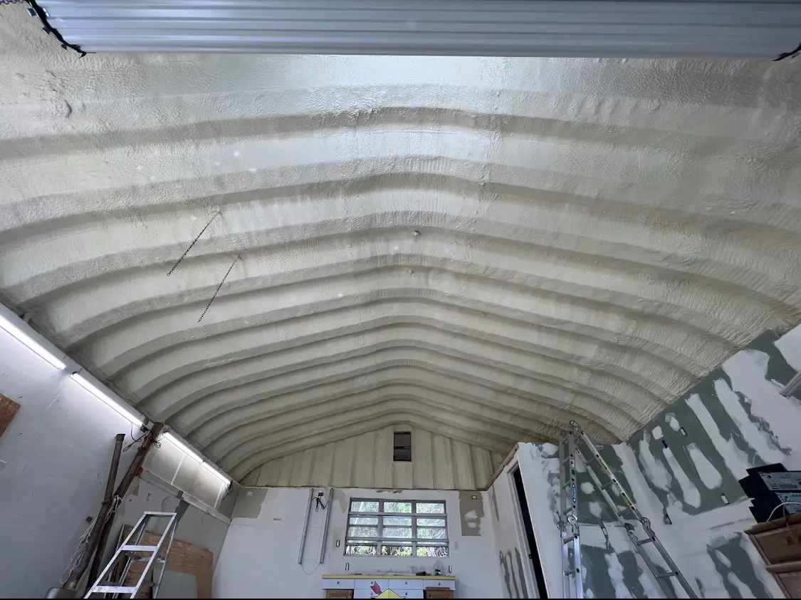 Spray polyurethane foam applied to the underside of a metal roof deck in Clairton